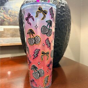 Brand new. Never used. Colorful Cherry and Bow Tumbler